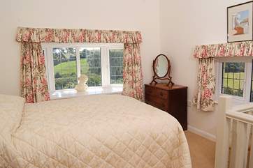 The master bedroom has windows to two sides so you can sit in bed and have uninterrupted views of the beautiful countryside.