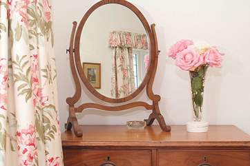 A pretty mix of antique and modern furnishings adds warmth and character to the cottage.