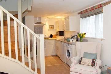 The open plan living, dining and kitchen area is lovely and cheerful.