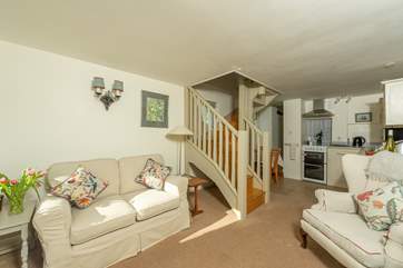 Inside, the cottage has an open plan ground floor with a single bedroom and shower room at the far end too. There is one step down into the kitchen/living room area.