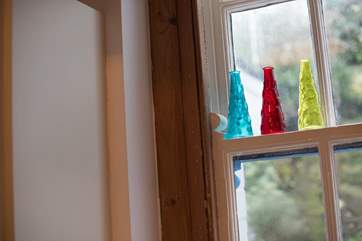 Sunlight shines through the coloured glass.