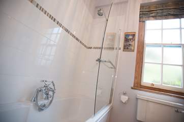 There is a fitted shower over the bath as well as a hand-held shower attachment.