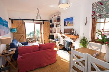 The sitting/dining-room is a delight.