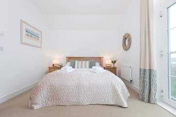 A wonderfully comfortable king-size bed.