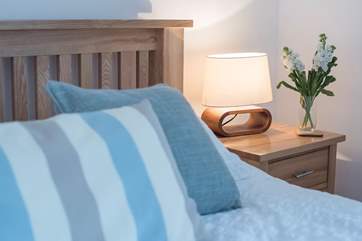 Cushions and throws dress the beds.