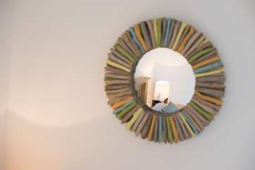 A handmade driftwood mirror.