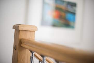 A bespoke oak staircase and solid oak furniture in all rooms shows the level of investment in the property.