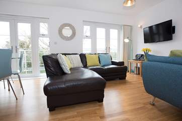 A big wall-mounted TV for family films and important sports events.