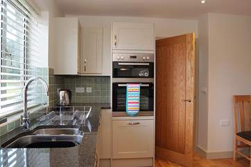 A door from the kitchen-area leads through to the hall.
