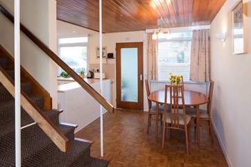 The stairs go up between the kitchen-diner and the sitting-room.