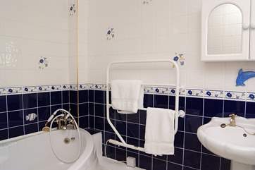 The bathroom has a whirlpool bath.