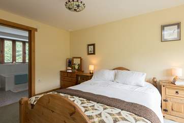 Another view across the master bedroom to show the door to the ensuite bathroom.