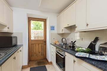 As well as the galley-style kitchen there is a separate utility room. This cottage is really well equipped for your stay.