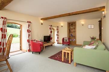 There is a really spacious living/dining room with two sets of French windows to the gardens.