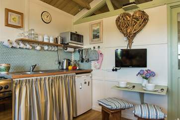 The kitchen is very well-equipped and there is also a small dining-area.