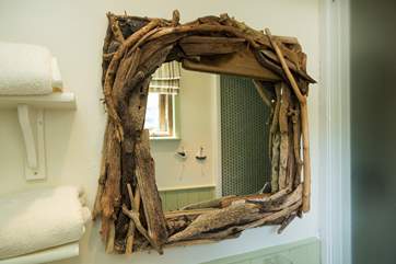 There are reminders throughout about the name... a driftwood mirror.