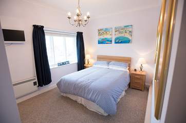 The master bedroom with calming tones.