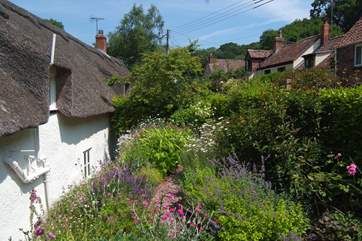 The back garden is just as beautiful and up the steps from the back of the house there is another gorgeous place to sit and relax.
