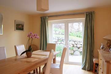 The separate dining-room also has doors opening out to the back garden.