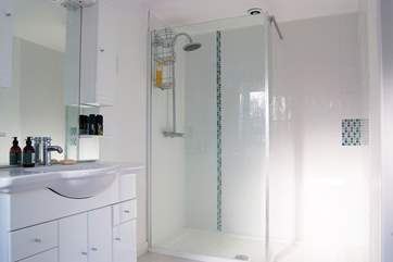 Bedroom 2's en suite shower-room includes a large walk-in shower.