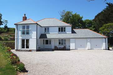 There is lots of space to park outside this impressive home, this is your space as the owners park in spaces to the right of the picture.