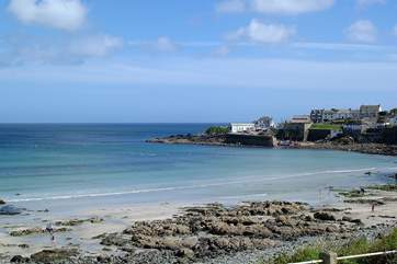 Coverack beach is sandy at low tide.
