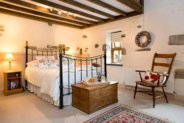 Bedroom 1 has a beautiful bedstead.