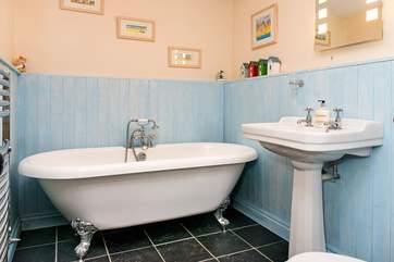 The main bathroom has a gorgeous free-standing bath.