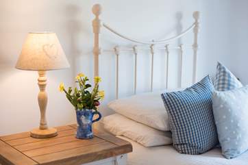 The twin bedroom is decorated with style.