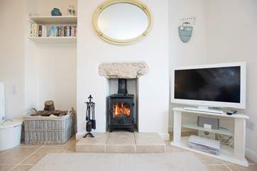 The sitting room has a roaring wood-burner.