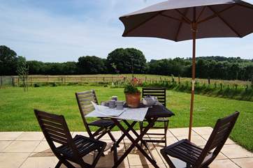 The patio and garden look out over fields and to the countryside beyond. A beautiful place to start and end the day.