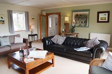 The sitting-room is very spacious and beautifully furnished.