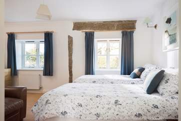 This is a comfortable and light bedroom.