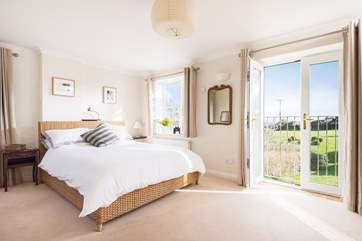 Bedroom 2 also has a Juliet balcony with lovely views across the countryside to Falmouth Bay.