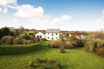 A birds eye view of the house and gardens.