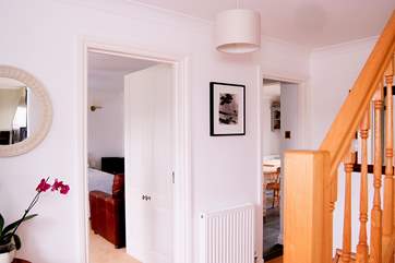 Bedroom 1 is off the hall, opposite the staircase leading up to the first floor.