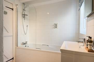 There is a fitted shower over the bath.