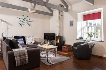 Snuggle up in front of the wood burner after a long day exploring.
