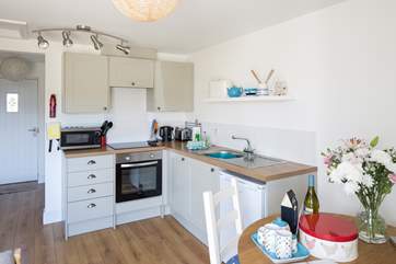 The cleverly designed kitchen is integrated within the living area.