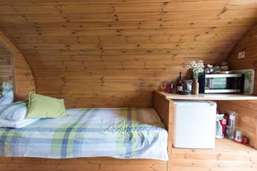 The single beds (2' wide) are position on each side of the Living Pod.