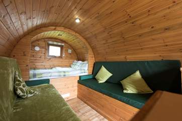 The single beds convert into your living-space and create two long bench sofas.