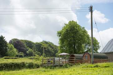 Looking back towards the Living Pod on the left and the Uilities Pod on the right with the Owners' farmhouse in the background.