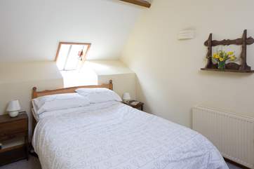 The double bed in Bedroom 1.