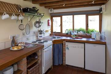 The kitchen looks out over the stream.