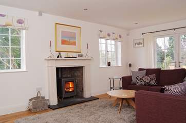The sitting-area has a roaring wood-burner.