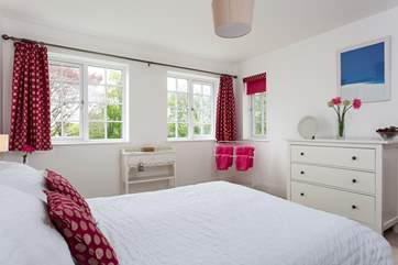 The master bedroom overlooks the rear garden.