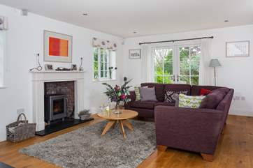 The open plan living-room is a sociable place to relax in and has a wood burner if the evenings happen to get a little chilly.