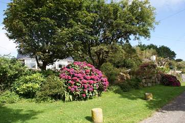 The cottage is set in mature well-maintained gardens.