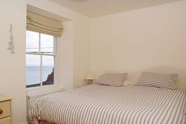 A comfortable 6' bed in the first floor double bedroom and fabulous sea views.