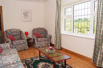 The living-room looks out over the garden.